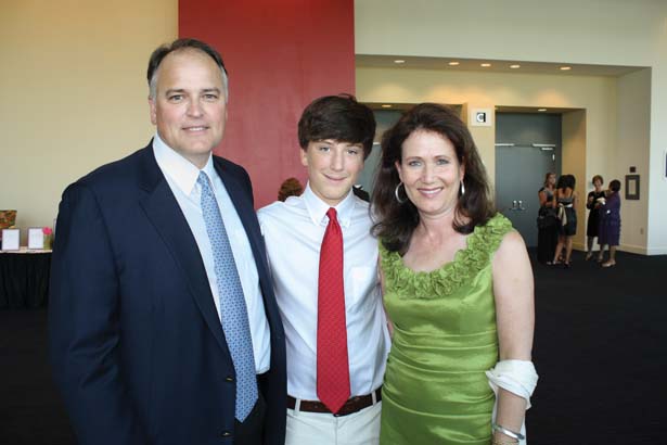 Wayne and Mary Ann Moore with their son, Davis Moore (center)