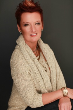 Tona Jolly, production manager for Arkansas Business Publishing Group, after hair and makeup by Cassie Francioni. Sweater and jewelry from Scarlet. Jeans from Beyond Cotton II.